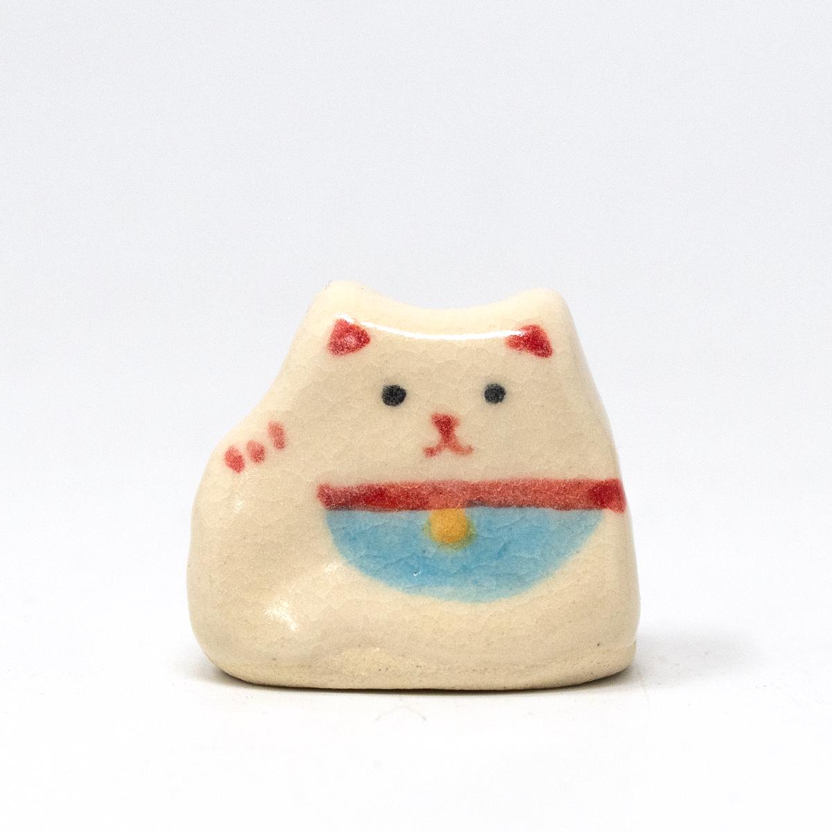 white cat incense holder front