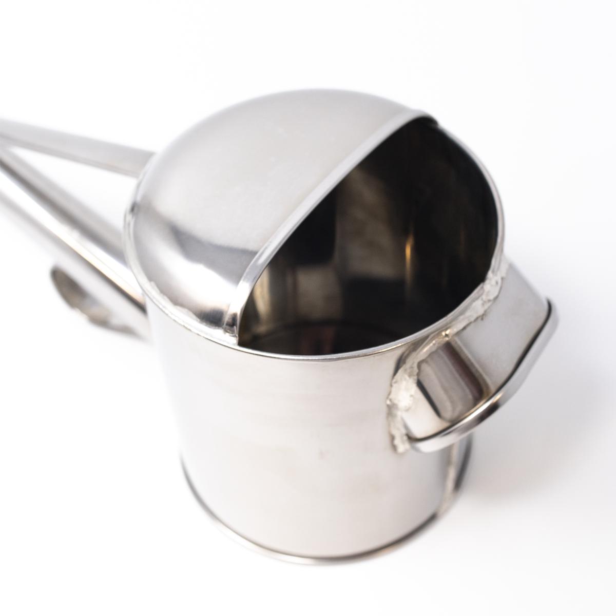 silver watering can inside