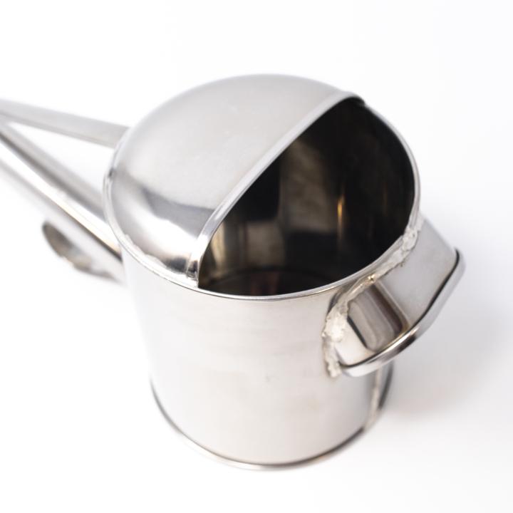 silver watering can inside
