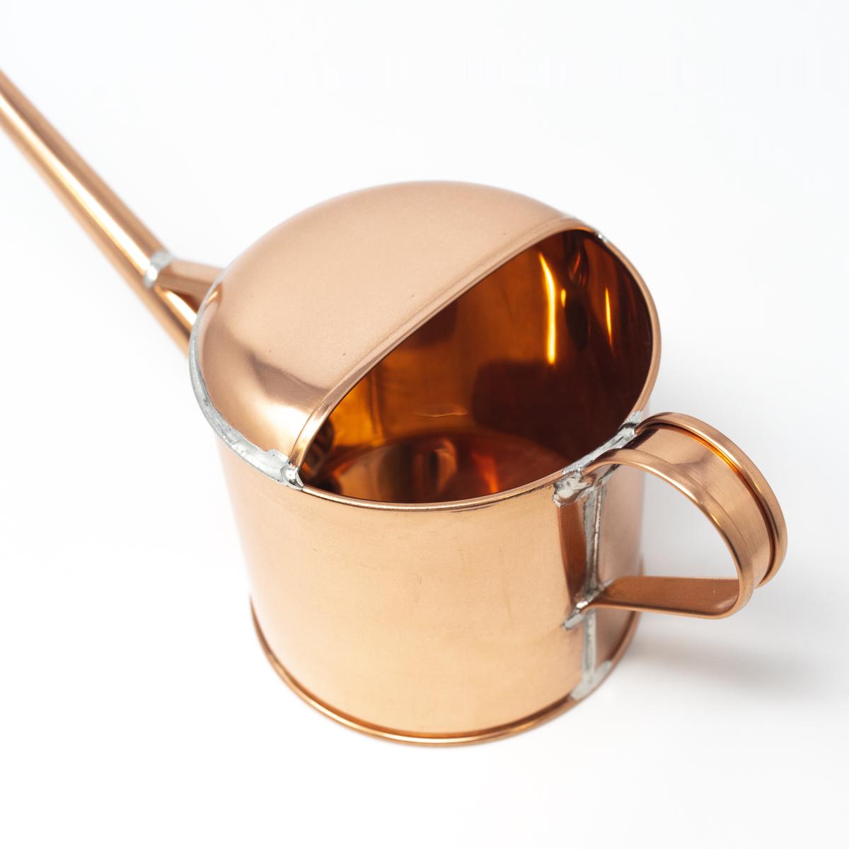 small copper watering can inside