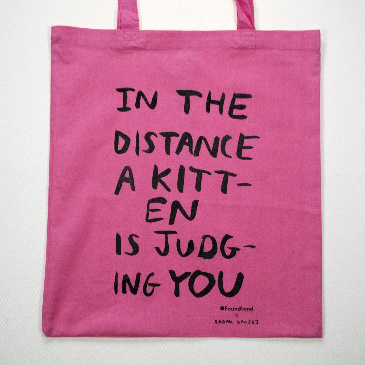 pink judging kitten