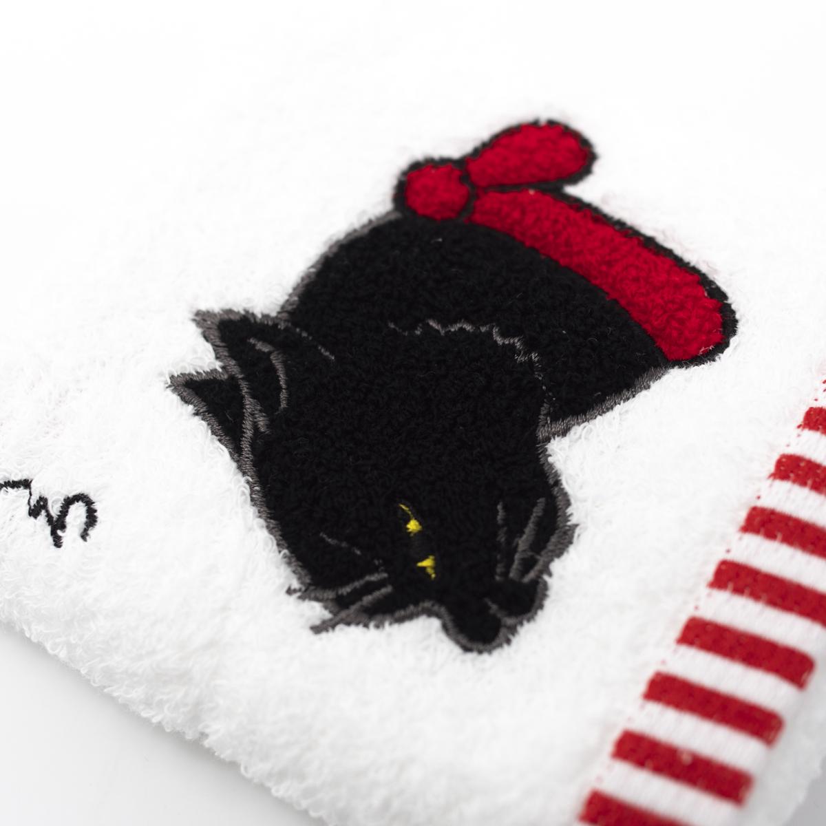 black cat towel closeup