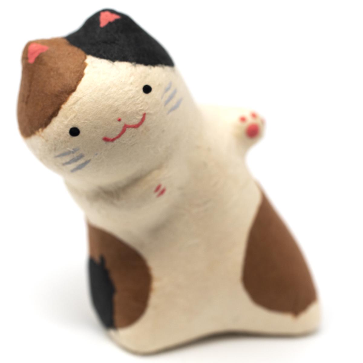 haibara brown black white leaning cat closeup