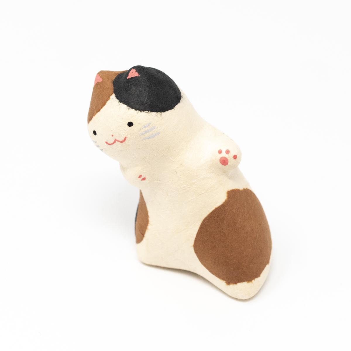 haibara brown black white leaning cat top angle