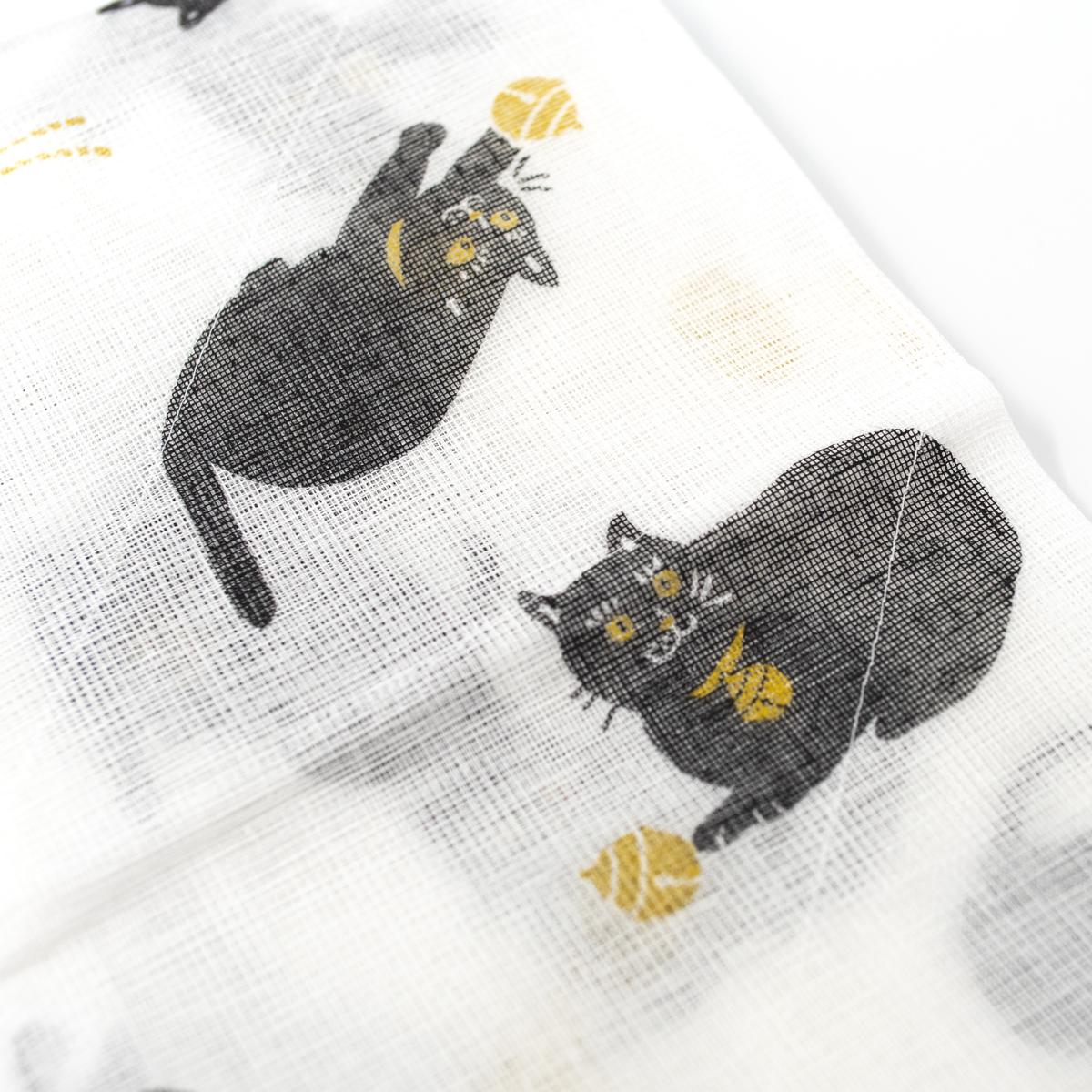 general cat washing up cloth yellow closeup