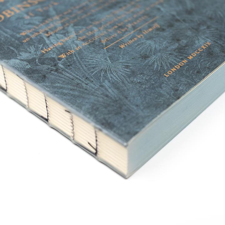 slow design robinson crusoe notebook spine closeup