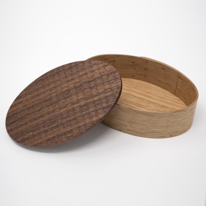 plain wooden oval box open