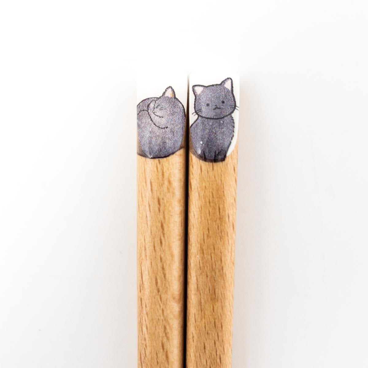 general cat chopsticks locket closeup