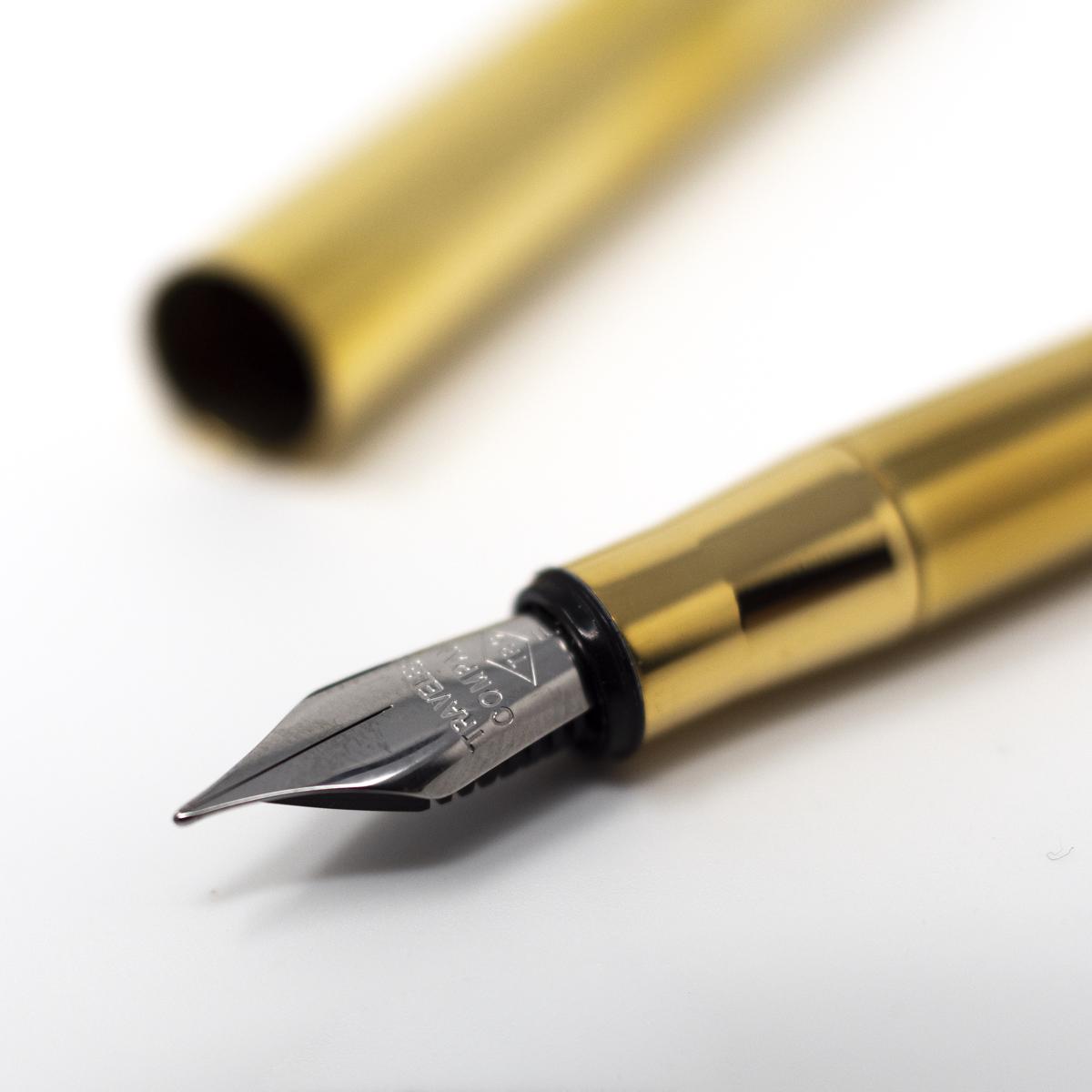 notable midori brass pen closeup