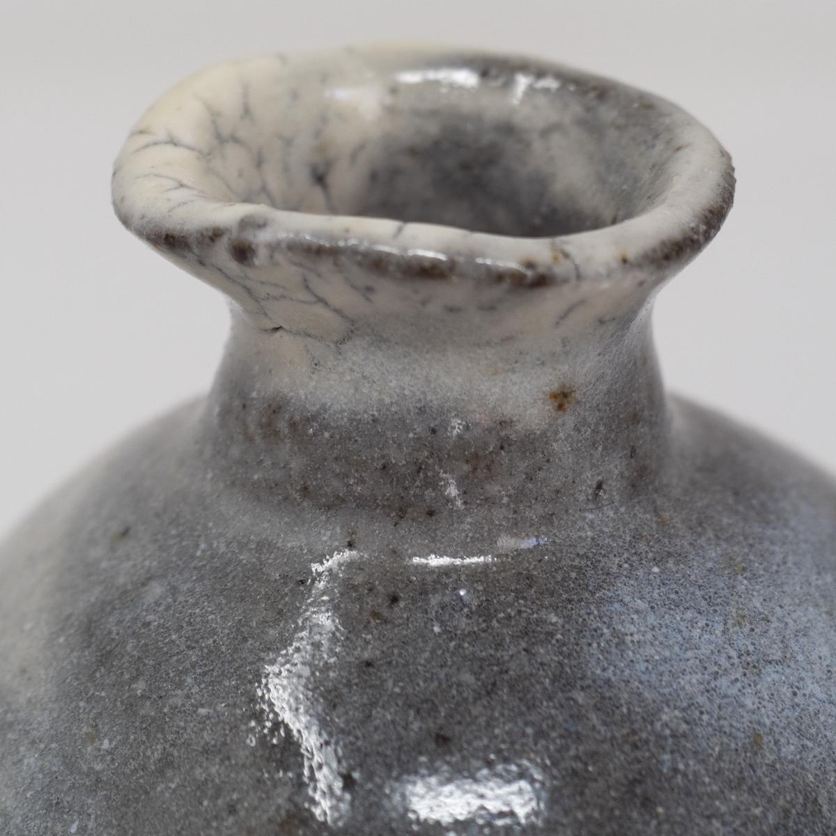 isao white vase lip closeup
