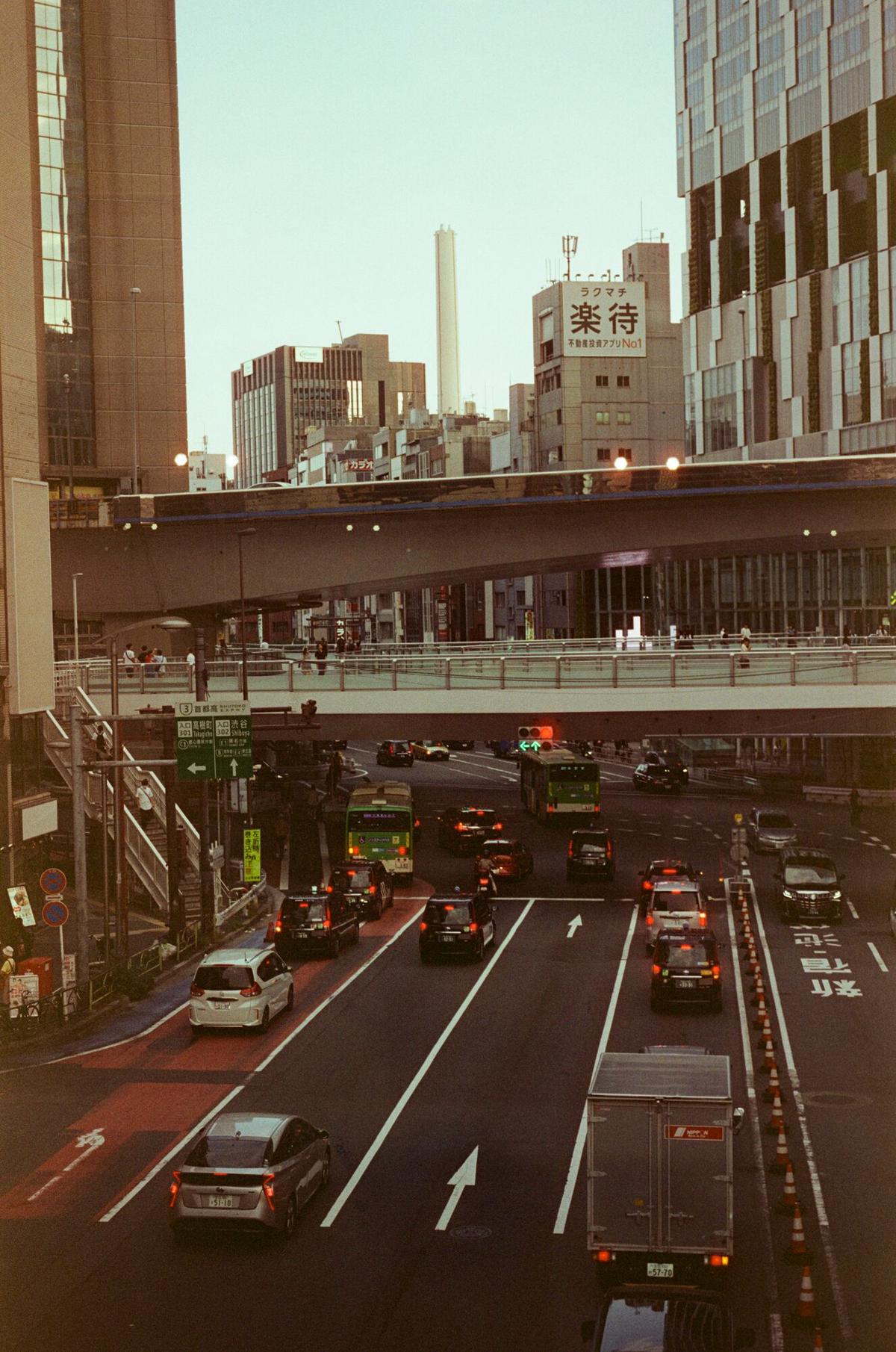 Tokyo traffic and office towers seen from above on the way across town