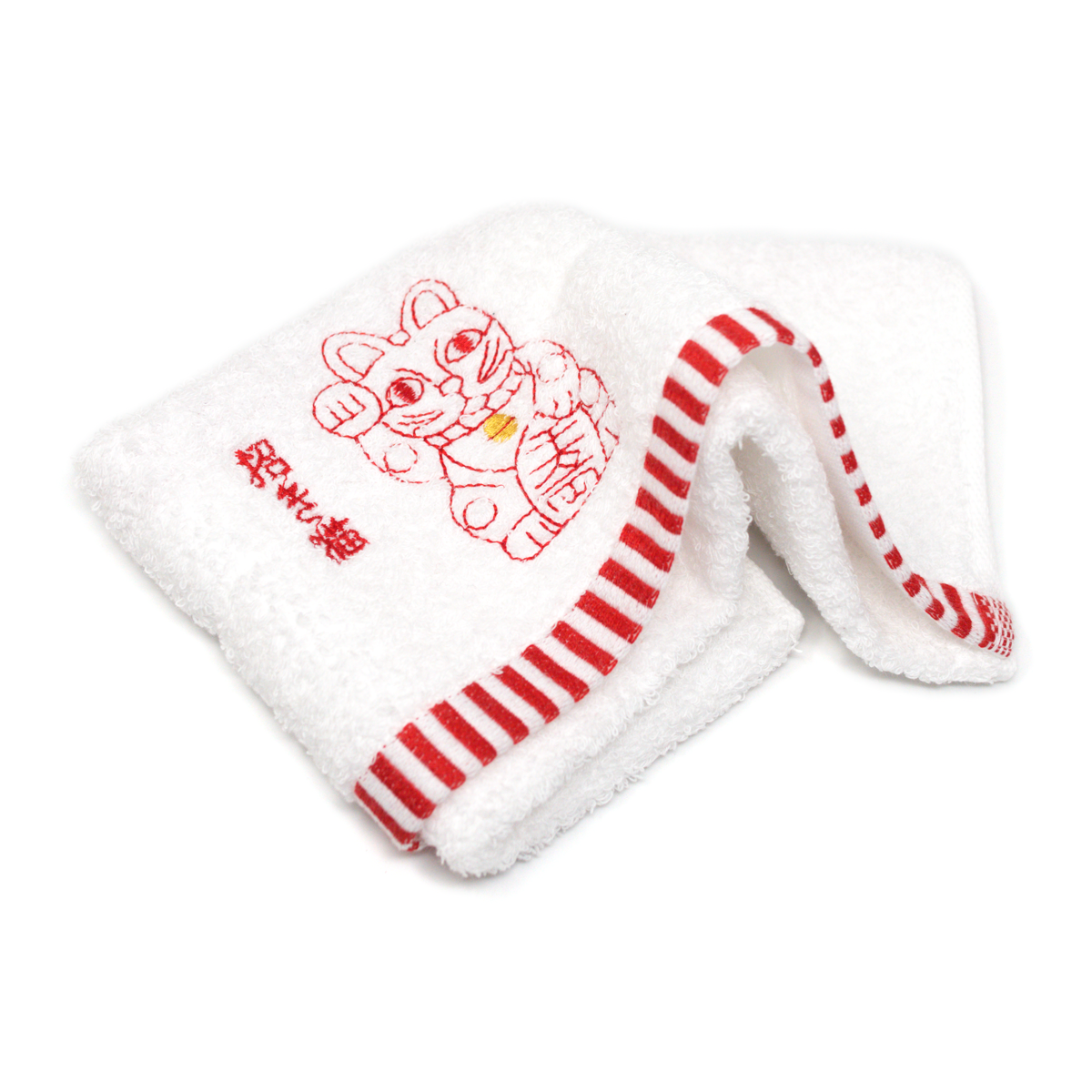White hand towel with red stripes and an embroidered red maneki neko, partly unfolded