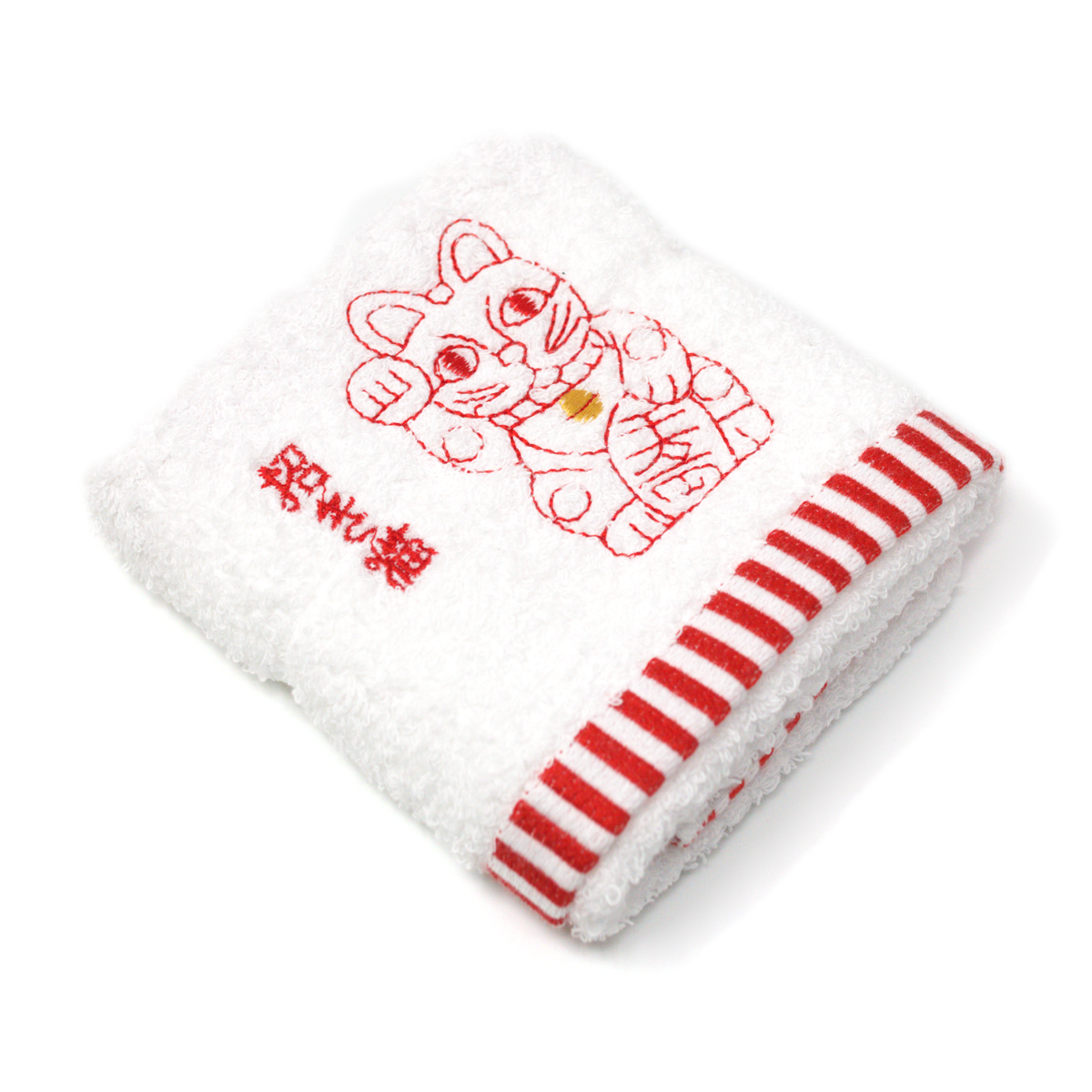 White hand towel with red stripes and an embroidered red maneki neko, seen at an angle